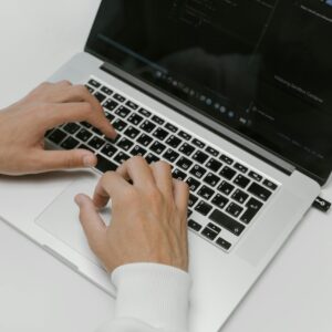 Free Hands on a Laptop Keyboard Stock Photo